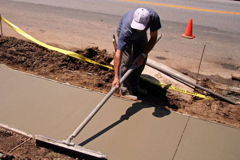 Contractor Assessing Sidewalks